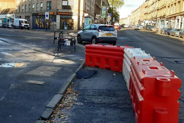 The temporary lane is only 1m wide, with cyclists having to negotiate a narrow ramp of Tarmac from the pavement. Picture: The Scotsman