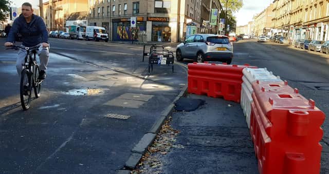 The temporary lane is only 1m wide, with cyclists having to negotiate a narrow ramp of Tarmac from the pavement. Picture: The Scotsman