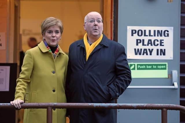Former SNP leader Nicola Sturgeon with husband Peter Murrell as they cast their votes in the 2019 General Election at Broomhouse Park Community Hall in Glasgow. Picture: Andrew Milligan/PA Wire