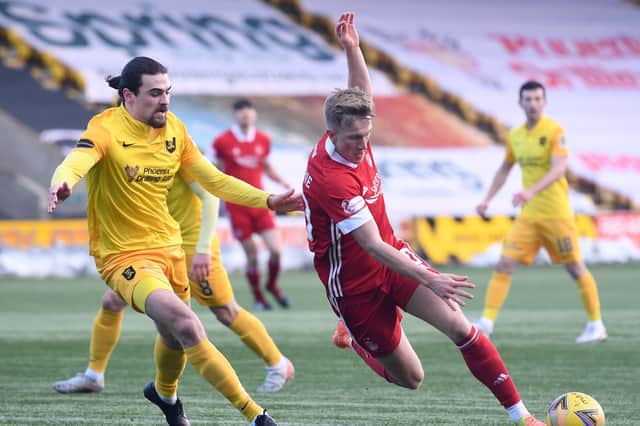 Livingston's Ciaron Brown (L) in action with Ross McCrorie of Aberdeen during a forgettable 0-0 draw between the sides (Photo by Craig Foy / SNS Group)