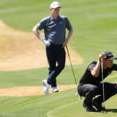 Bob MacIntyre looks on as Collin Morikawa lines up a putt during their opening-day tie in the WGC-Dell Technologies Match Play at Austin Country Club in Austin, Texas. Picture: Kevin C. Cox/Getty Images.