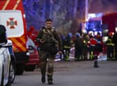 Rescue workers at the scene of a missile strike in the Pechers district in Kyiv, Ukraine.
