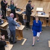 Outgoing First Minister Nicola Sturgeon leaves the main chamber after her last First Minster's Questions (FMQs) in the main chamber of the Scottish Parliament in Edinburgh.