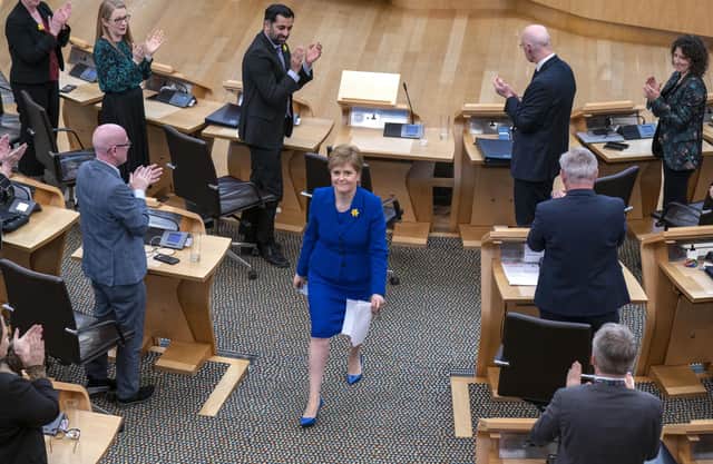 Outgoing First Minister Nicola Sturgeon leaves the main chamber after her last First Minster's Questions (FMQs) in the main chamber of the Scottish Parliament in Edinburgh.