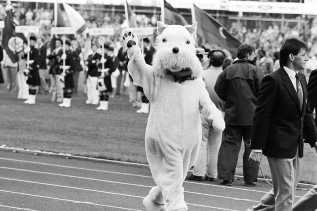 A Scottie dog mascot waves goodbye at the closing ceremony of the 1986 Commonwealth Games at Meadowbank Stadium.