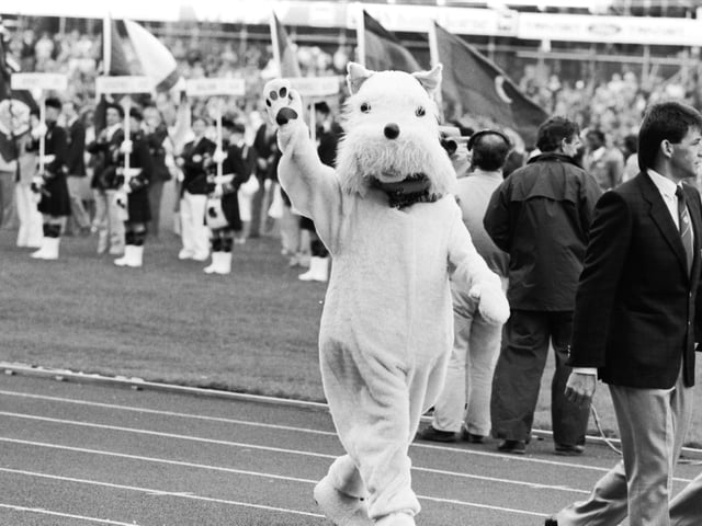 A Scottie dog mascot waves goodbye at the closing ceremony of the 1986 Commonwealth Games at Meadowbank Stadium.