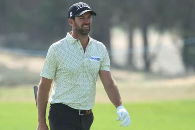 Scott Jamieson walks up the 18th hole on day one of the Ras al Khaimah Championship presented by Phoenix Capital at Al Hamra Golf Club. Picture: Andrew Redington/Getty Images.