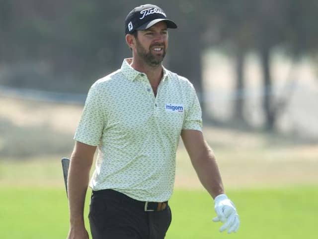 Scott Jamieson walks up the 18th hole on day one of the Ras al Khaimah Championship presented by Phoenix Capital at Al Hamra Golf Club. Picture: Andrew Redington/Getty Images.