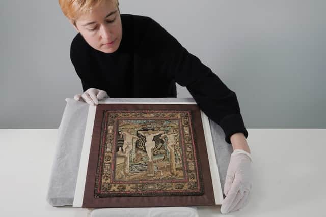 Helen Wyld, Senior Curator of Historic Textiles at National Museums Scotland, with the rare 400-year-old embroidery that was likely a private altar piece which survived the Reformation. PIC:  Stewart Attwood