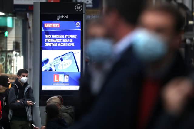 A digital advertising board in Glasgow displaying a news article about the possibility of a vaccine being found. Picture: Andrew Milligan/PA Wire