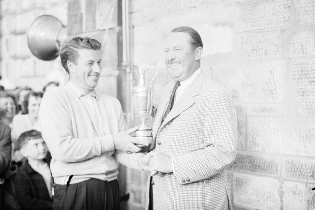 Peter Thomson presents winner Bobby Locke with the Claret Jug at the 1957 Open Championship in St Andrews.
