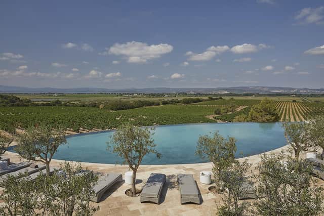 The ourdoor pool overlooking the vineyards and lagoon with the Pyrenees in the distance, at Chateau Capitoul. Pic: Contributed/Patrick Brunet