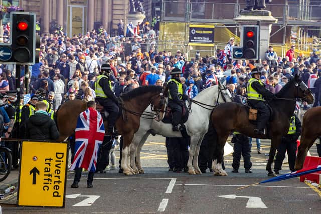Five police officers were injured and 28 people were arrested amidst the disorder in Glasgow's George Square. Picture: Lisa Ferguson 






Rangers fans gather at George Square this afternoon after Rangers lift The SPFL Premier League Cup on the last day of the season