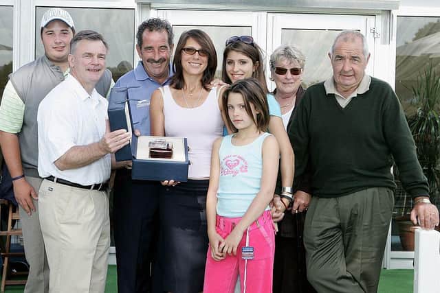 Sam Torrance, accompanied by his family, is presented with a rare bottle of whisky by Ken Schofield to mark his 700th start on the European Tour in the 2006 Barclays Scottish Open at Loch Lomond. Picture: Richard Heathcote/Getty Images.