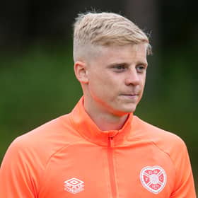 Alex Cochrane is on loan at Hearts from Brighton.
