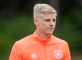 Alex Cochrane is on loan at Hearts from Brighton.