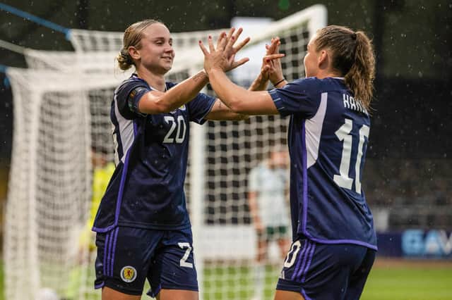 Scotland's Martha Thomas celebrates with Kirsty Hanson after making it 3-0 during the victory over Northern Ireland at Dens Park.