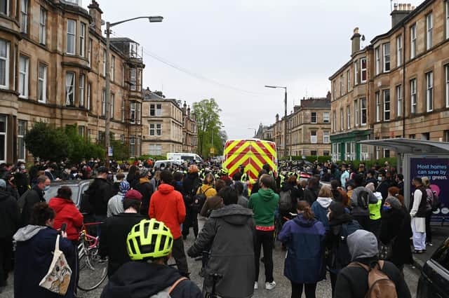 The street has been filled with protesters and police.