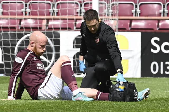 Liam Boyce is forced off injured in Hearts' final game of the season against Rangers.