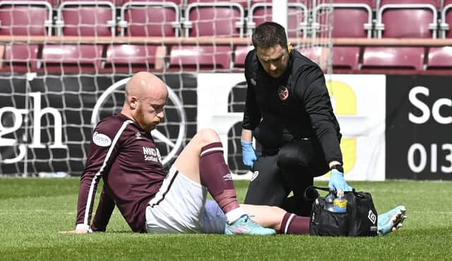 Liam Boyce is forced off injured in Hearts' final game of the season against Rangers.