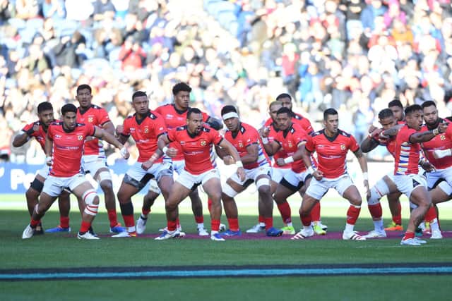 Tonga's players perform the Sipi Tau pre-match ritual at Murrayfield. (Photo by Ross MacDonald / SNS Group)