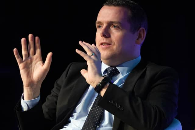 Douglas Ross speaking on stage on the second day of the Scottish Conservative party conference at the Scottish Event Campus (SEC) in Glasgow.