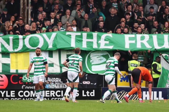 Celtic fans protest over ticket pricing by throwing tangerines onto the pitch  (Photo by Craig Williamson / SNS Group)