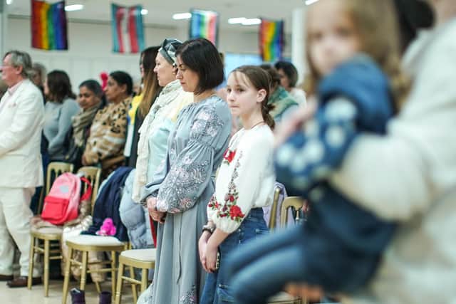 The decision to house Ukrainian refugees, seen observing a minute's silence for Ukrainian troops, on the MS Victoria cruise ship explains one reason why migrants don't move to Scotland – a lack of housing (Picture: Peter Summers/Getty Images)