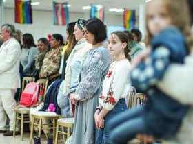 The decision to house Ukrainian refugees, seen observing a minute's silence for Ukrainian troops, on the MS Victoria cruise ship explains one reason why migrants don't move to Scotland – a lack of housing (Picture: Peter Summers/Getty Images)