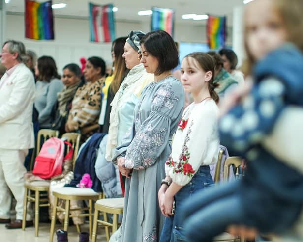 The decision to house Ukrainian refugees, seen observing a minute's silence for Ukrainian troops, on the MS Victoria cruise ship explains one reason why migrants don't move to Scotland – a lack of housing (Picture: Peter Summers/Getty Images)