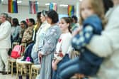 The decision to house Ukrainian refugees, seen observing a minute's silence for Ukrainian troops, on the MS Victoria cruise ship explains one reason why migrants don't move to Scotland – a lack of housing (Picture: Peter Summers/Getty Images)