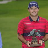 Patrick Reed with the trophy after winning the Farmers Insurance Open at Torrey Pines. Picture: Gregory Bull/AP