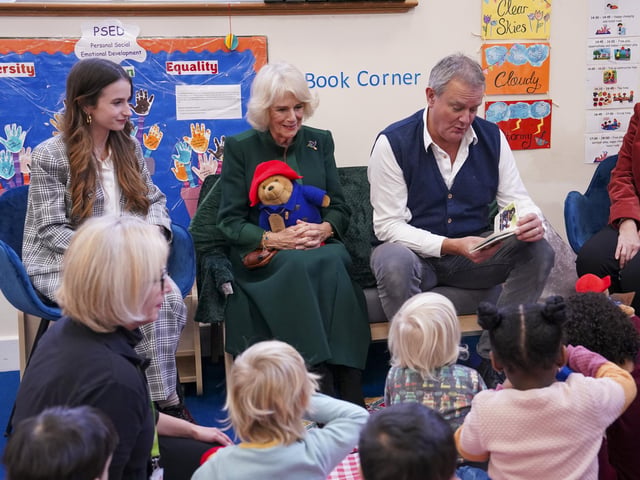 The Queen Consort with actors Madeleine Harris, Hugh Bonneville during a special teddy bears picnic at a Barnardo's Nursery in Bow, London, where she personally delivered Paddington bears and other cuddly toys, which were left as tributes to Queen Elizabeth II at Royal Residences, to children supported by the charity.