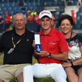 Sam Locke, flanked by his parents, shows off the Silver Medal after finishing as leading amateur in 2018 Open at Carnoustie. Picture: Andy Buchanan/AFP via Getty Images.