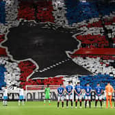 Rangers and Napoli players observe a minute's silence to mark the death of Queen Elizabeth II ahead of the Champions League match at Ibrox. (Photo by ANDY BUCHANAN/AFP via Getty Images)