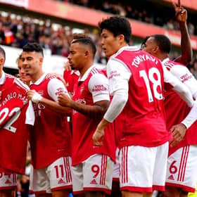 Arsenal's Gabriel Martinelli (centre) holds up former team-mate Pablo Mari's shirt as he celebrates scoring their side's first goal of the game during the Premier League match at the Emirates Stadium,