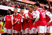 Arsenal's Gabriel Martinelli (centre) holds up former team-mate Pablo Mari's shirt as he celebrates scoring their side's first goal of the game during the Premier League match at the Emirates Stadium,