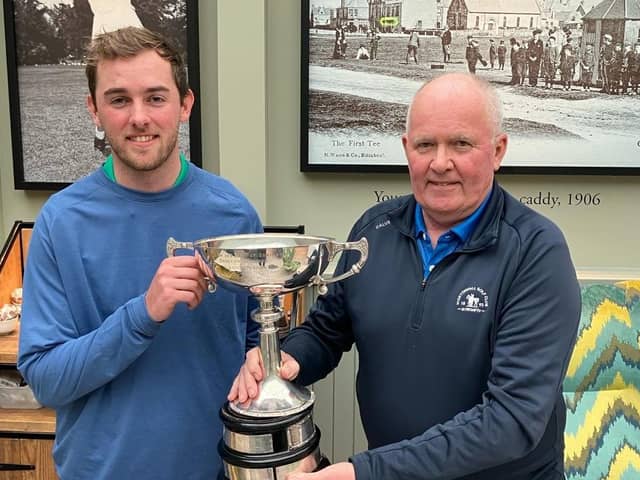 Kilspinde trainee professional Rob Paterson, left, is presented with The UniRoyal Trophy by Edinburgh & East of Scotland Alliance secretary Alan Greenshields after his win at Gullane. Picture: East Alliance