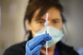 Retired nurse manager Siobhan Boyle administers a covid vaccine at the Just the Jab pop up vaccination centre at Kinspan Ulster Rugby Stadium in Belfast. Picture date: Saturday November 27, 2021.