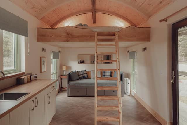 Like the other Shepherd Hut, Bothan has a palette of greys, whites, greens and natural wood finishes that echo the setting