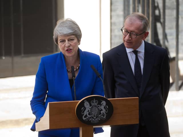 Britain's outgoing prime minister Theresa May, (L), accompanied by her husband Philip, gives a speech outside 10 Downing street in London on July 24, 2019 before formally tendering her resignation at Buckingham Palace. Photo credit should read ISABEL INFANTES/AFP via Getty