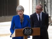 Britain's outgoing prime minister Theresa May, (L), accompanied by her husband Philip, gives a speech outside 10 Downing street in London on July 24, 2019 before formally tendering her resignation at Buckingham Palace. Photo credit should read ISABEL INFANTES/AFP via Getty