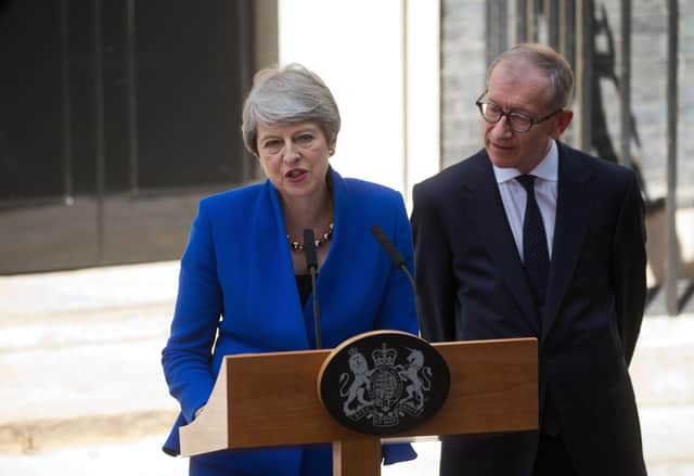 Britain's outgoing prime minister Theresa May, (L), accompanied by her husband Philip, gives a speech outside 10 Downing street in London on July 24, 2019 before formally tendering her resignation at Buckingham Palace. Photo credit should read ISABEL INFANTES/AFP via Getty