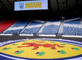 Scotland fans have been asked to take part in a minute's applause in memory of Queen Elizabeth II