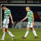Celtic players trudge off the field at full-time. Picture: SNS