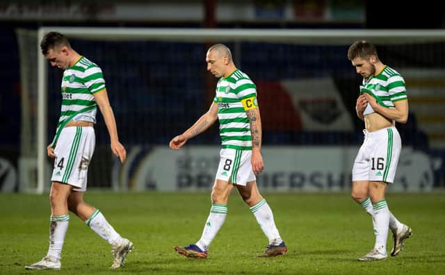 Celtic players trudge off the field at full-time. Picture: SNS