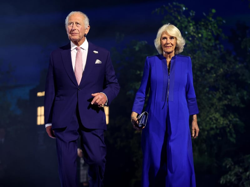 King Charles III and Queen Camilla walk on stage during the opening ceremony ahead of the Glasgow 2026 Commonwealth Games at The Hydro