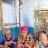 Women from previously-occupied villages work on crafts at Heritage Ukraine's summer camp.