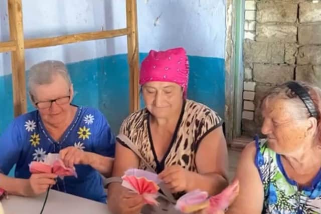 Women from previously-occupied villages work on crafts at Heritage Ukraine's summer camp.