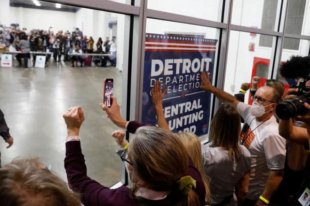 Trump supporters bang on the glass and chant slogans outside the room where absentee ballots were being counted at the TCF Center in Detroit, Michigan (Picture: Jeff Kowalsky/AFP via Getty Images)